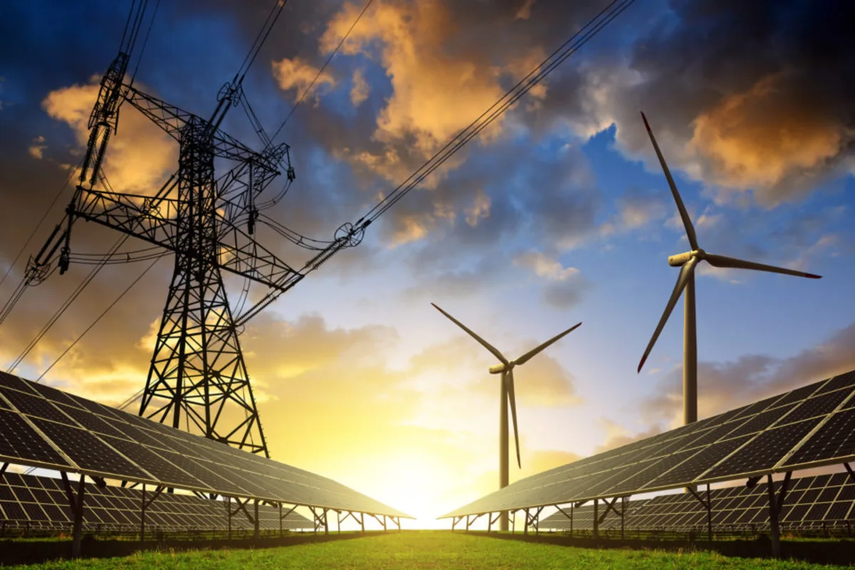 Infraestructura energética con paneles solares, aerogeneradores y red eléctrica